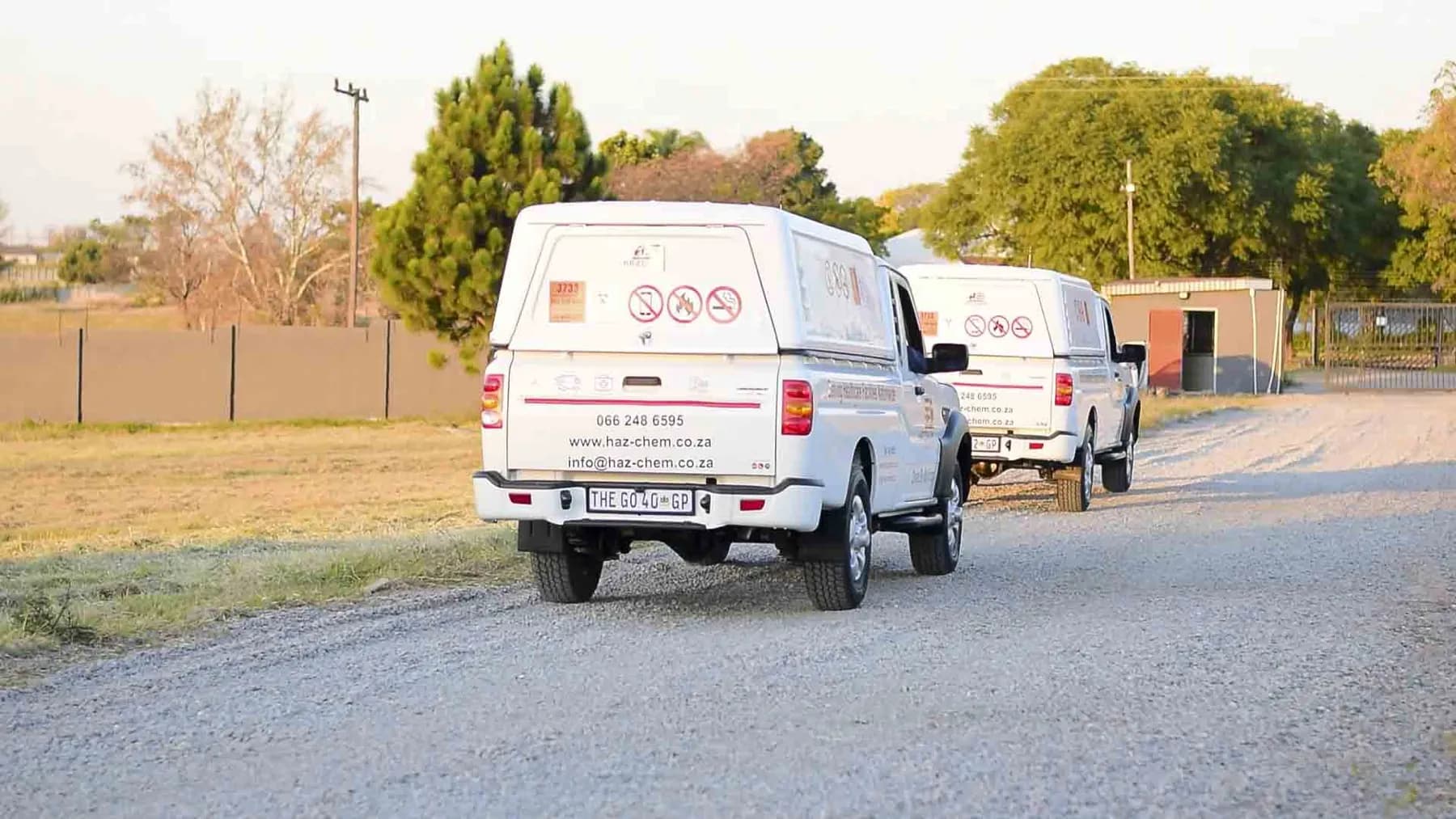 Hazchem bakkies on a gravel road