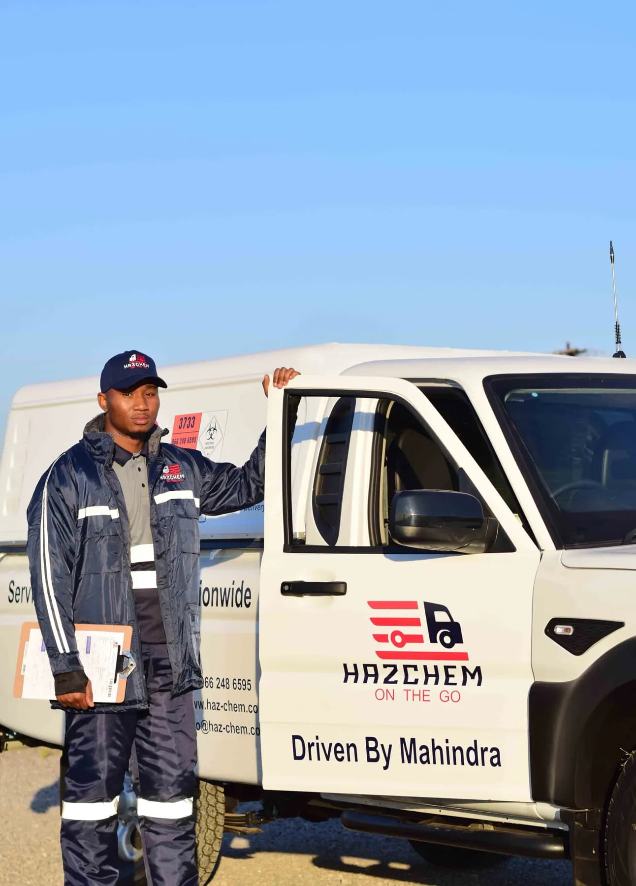 Crew member at an open cab door
