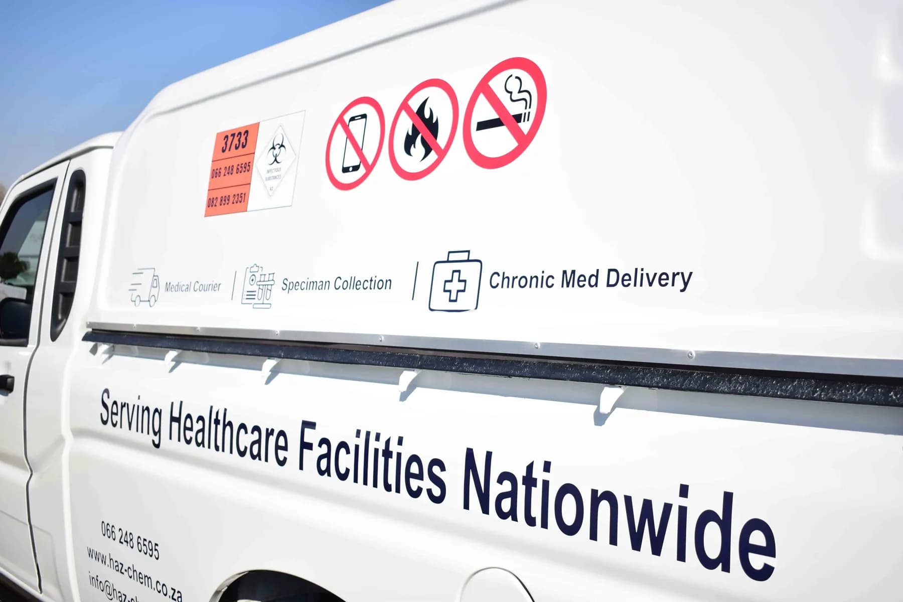 Hazchem canopy signage reading Serving Healthcare Facilities Nationwide