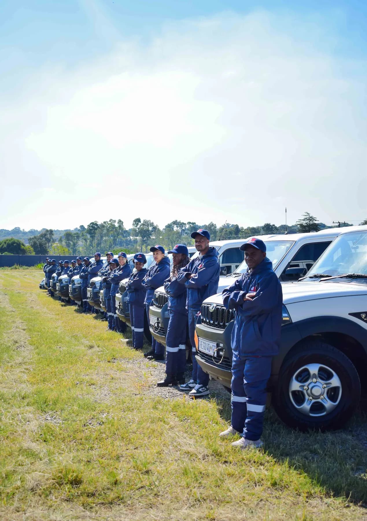 Hazchem crew line-up beside the fleet